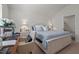 Spacious main bedroom suite boasts natural light and a calming color scheme at 1891 Frost Dr, Haw River, NC 27258