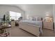 Relaxing main bedroom features a vaulted ceiling, a large window, and a desk area at 1891 Frost Dr, Haw River, NC 27258