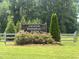 Welcoming entrance sign to Graham Regional Park with blooming flowers and lush landscaping at 1891 Frost Dr, Haw River, NC 27258