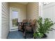 Quaint back patio with outdoor seating and a blue patterned rug at 1891 Frost Dr, Haw River, NC 27258