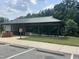 Shaded picnic shelter with tables and grill, perfect for outdoor gatherings and picnics at 1891 Frost Dr, Haw River, NC 27258