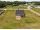 Aerial view of the backyard of a grey house with a deck at 19 Linda Lou Ln # 19, Angier, NC 27501
