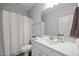 Clean bathroom features a white vanity, sink, and a shower with a curtain at 19 Linda Lou Ln # 19, Angier, NC 27501