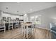 Bright dining area featuring a white table and chairs next to a spacious kitchen with a breakfast bar at 19 Linda Lou Ln # 19, Angier, NC 27501