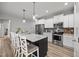 Bright, spacious kitchen features stainless steel appliances, granite countertops, and dark backsplash at 19 Linda Lou Ln # 19, Angier, NC 27501