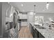 Spacious kitchen with stainless steel appliances, granite countertops, and a view of the dining area at 19 Linda Lou Ln # 19, Angier, NC 27501