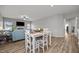 Open-concept living room showcases hardwood floors, a fireplace, and comfortable seating area at 19 Linda Lou Ln # 19, Angier, NC 27501