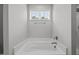 An oversized soaking tub is located beneath a window at 19 Linda Lou Ln # 19, Angier, NC 27501