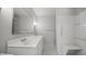 A modern bathroom featuring a spacious vanity, a well-lit mirror, and a convenient shower and tub combination at 1926 Downing Dr, Burlington, NC 27215