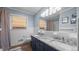 Classic bathroom with white tile, granite countertop, double sinks, and ample mirror space at 1926 Downing Dr, Burlington, NC 27215