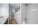 Bright bathroom with white tiled shower, and stylish fixtures at 1926 Downing Dr, Burlington, NC 27215