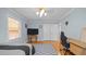 Bright bedroom with hardwood floors, a large window, and a modern ceiling fan at 1926 Downing Dr, Burlington, NC 27215