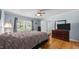 Bedroom with hardwood floors, window and nice view of the surrounding neighborhood at 1926 Downing Dr, Burlington, NC 27215