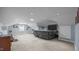 Large bonus room with plush carpeting, recessed lighting, and comfortable seating at 1926 Downing Dr, Burlington, NC 27215