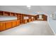 Spacious bonus room with extensive custom built-in shelving and ample storage at 1926 Downing Dr, Burlington, NC 27215