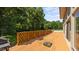 Expansive deck offers great outdoor living space with wood railing and natural surroundings at 1926 Downing Dr, Burlington, NC 27215