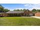 Charming brick home featuring a well-manicured lawn, attached garage, and inviting curb appeal at 1926 Downing Dr, Burlington, NC 27215