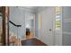 Hallway showcasing neutral paint and trim, as well as terracotta tile flooring and natural light at 1926 Downing Dr, Burlington, NC 27215