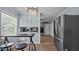 Cozy kitchen with stainless steel refrigerator, wood floors and views to the breakfast area at 1926 Downing Dr, Burlington, NC 27215
