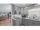Efficient kitchen with neutral cabinets, modern appliances, and an open view to the living area at 1926 Downing Dr, Burlington, NC 27215