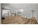 Expansive living area with hardwood floors, recessed lighting, and an open layout connecting the kitchen and dining spaces at 1926 Downing Dr, Burlington, NC 27215