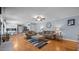 Open-concept living room with hardwood floors, neutral decor, and a view of the kitchen at 1926 Downing Dr, Burlington, NC 27215