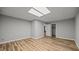 An empty room with neutral walls and vinyl floors leads to a large closet and bedroom at 1926 Downing Dr, Burlington, NC 27215