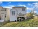 The backyard has a wooden deck and is partially fenced, with a view of the two-story house at 1968 Shadow Glen Dr, Raleigh, NC 27604