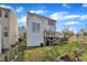 Image showing the yard, fence, wood deck and back exterior of the home with white siding at 1968 Shadow Glen Dr, Raleigh, NC 27604