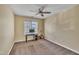 Bedroom with a ceiling fan and a window letting in natural light over a desk at 1968 Shadow Glen Dr, Raleigh, NC 27604