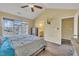Spacious bedroom with vaulted ceiling, walk-in closet, and access to the bathroom at 1968 Shadow Glen Dr, Raleigh, NC 27604