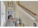 Foyer featuring an attractive console table, staircase with wood railing, and view into the living room at 1968 Shadow Glen Dr, Raleigh, NC 27604