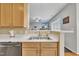 Kitchen sink with stainless steel faucet and view of the living area at 1968 Shadow Glen Dr, Raleigh, NC 27604