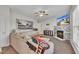 Living area features a cozy fireplace, large sectional sofa, and an inviting atmosphere for relaxation and entertainment at 1968 Shadow Glen Dr, Raleigh, NC 27604