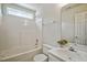 Bright bathroom featuring a shower-tub combo, toilet, and vanity with a large mirror at 2000 Silky Dogwood Trail Trl, Apex, NC 27502