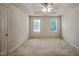 Spacious bedroom with neutral walls, carpet, recessed ceiling and natural light from two windows at 2000 Silky Dogwood Trail Trl, Apex, NC 27502