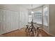 Cozy dining area with a round table, bar stools, and natural light from the windows at 2000 Silky Dogwood Trail Trl, Apex, NC 27502