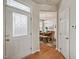 Bright entryway showcasing hardwood floors, a glass-paneled front door and an adjacent dining area at 2000 Silky Dogwood Trail Trl, Apex, NC 27502
