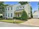 Charming two-story home featuring a well-manicured front yard, attached garage, and classic architectural details at 2000 Silky Dogwood Trail Trl, Apex, NC 27502