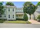 Charming two-story home featuring a well-manicured front yard, attached garage, and classic architectural details at 2000 Silky Dogwood Trail Trl, Apex, NC 27502