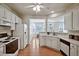 Bright kitchen with white appliances and wood flooring at 2000 Silky Dogwood Trail Trl, Apex, NC 27502