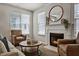 Inviting living room featuring a fireplace, accent furniture, and natural light at 2000 Silky Dogwood Trail Trl, Apex, NC 27502