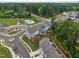 New townhome community featuring a neighborhood pool, mature trees, and sidewalks at 2006 Leo Dr, Apex, NC 27502