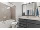 This modern bathroom offers a bathtub, a sleek vanity, and contemporary fixtures for a relaxing experience at 2006 Leo Dr, Apex, NC 27502