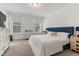 This light-filled main bedroom features plush carpeting, ample natural light, and stylish furnishings at 2006 Leo Dr, Apex, NC 27502