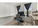 Bright home office with built-in desk, Murphy bed, and ample natural light, perfect for remote work at 2006 Leo Dr, Apex, NC 27502