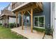 A shaded patio with lush green grass and a sliding glass door offers outdoor living space at 2006 Leo Dr, Apex, NC 27502