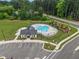Community pool with lounge chairs and umbrellas available for neighborhood residents at 2006 Leo Dr, Apex, NC 27502