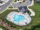 Community pool with tables and lounge chairs for residents in a fenced area at 2006 Leo Dr, Apex, NC 27502