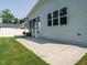 Inviting back patio with concrete, perfect for entertaining, leading to a screened-in porch at 2013 Woodbluff Dr, Wendell, NC 27591